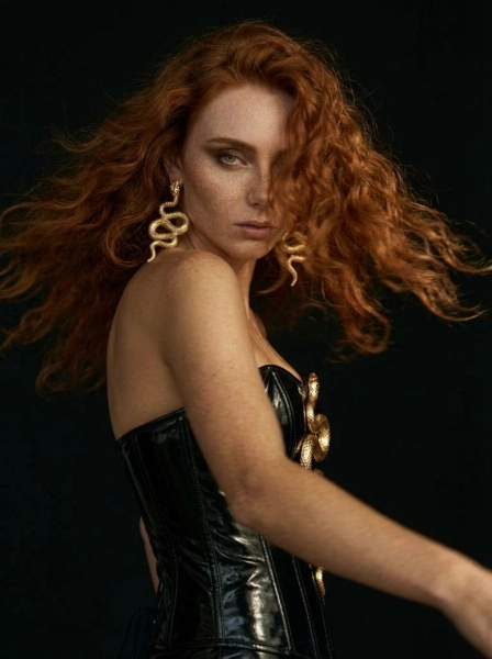 A_woman_with_long_flowing_red_hair_with_freckled_s-1774540884690